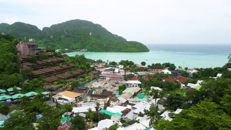 Densely-populated-local-homes-in-touristic-island-Koh-Phi-Phi-in-Thailand,-drone