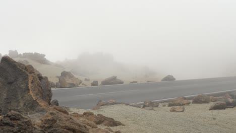 Road-covered-by-mist-at-Teide-National-Park,-static-handheld