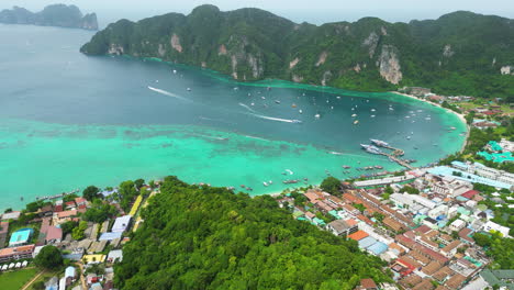 Aerial-View-Of-Coastal-Town-With-Clear-Blue-Sea-In-Koh-Phi-Phi-Island-In-Thailand