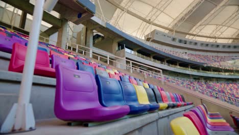 moving-shot-of-an-empty-professional-soccer-stadium-where-you-can-see-the-stands-of-different-colors-without-an-audience