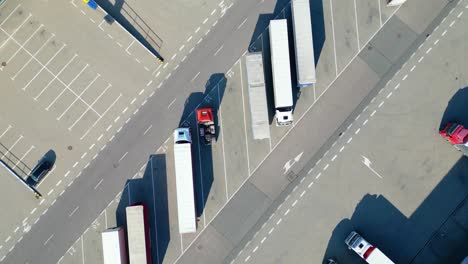 Aerial-view-of-distribution-center,-drone-photo-of-industrial-logistics-zone,new-super-modern-logistics-center-full-of-modern-technology-and-robotics,roof-solar-power-plant-for-green-energy-production