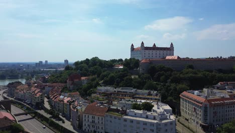 Aerial-View-Of-Bratislava-Castle-And-Old-Town-During-The-Day,-Drone-Aerial-View-4K-Establishing-Shot-of-the-Slovakian-European-Capital-City-during-the-summer