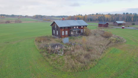 Drone-footage-of-an-old-abandoned-house-in-the-middle-of-a-big-field