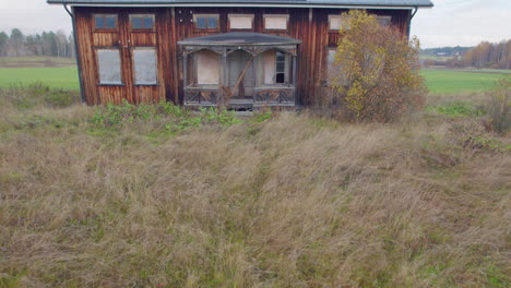 Aerial-drone-footage-of-a-big-abandoned-old-rustic-house