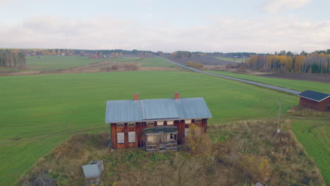 Drone-footage-of-a-old-abandoned-house-in-the-middle-of-vast-farmland