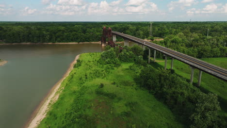 Highway-Bridge-Near-Twin-City-Riverfront-Park-In-Arkansas,-USA---aerial-drone-shot