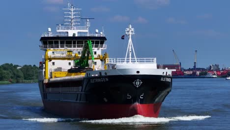 Close-up-view-of-the-cargo-ship-the-Sletringen-sailing-at-Zwijndrecht,-Netherlands