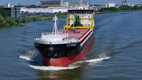 The-Sletringen-cargo-ship-cutting-through-the-water,-cinematic,-aerial,-slow-motion