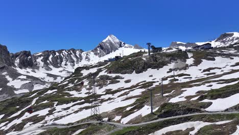 Wide-Angle-view-of-the-cable-cars-at-the-ski-resort-Kitzsteinhorn-travelling-up-and-down-the-Austrian-Alps