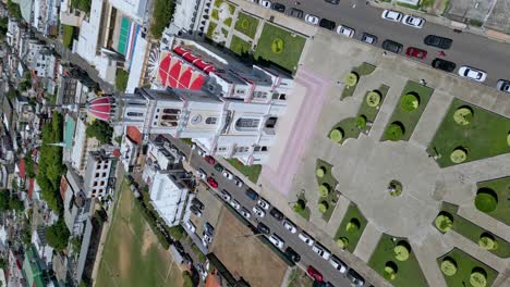 Vertical-drone-shot-Showing-famous-cathedral-Sacred-Heart-of-Jesus-in-Moca-during-sunny-day,-Dominican-Republic