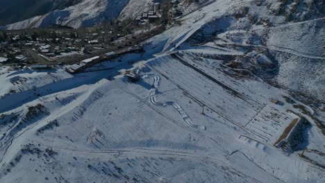 High-aerial-establishing-shot-of-an-empty-ski-slope-and-cable-care-in-Chile