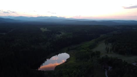 Sunset-drone-shot-of-the-Rocky-Mountains-and-forest-in-the-foreground