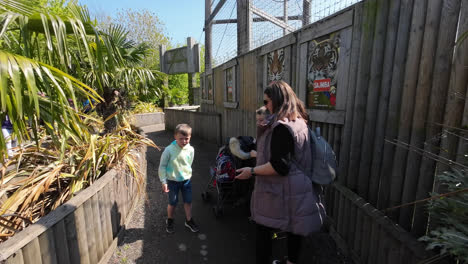 Family-enjoying-a-day-out-visiting-a-Dinosaur-theme-park-in-Lincolnshire-England