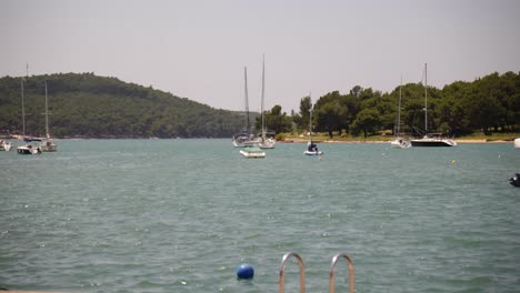 Young-family-and-cyclists-exercising-at-the-seaside,-Medulin,-Istria,-Croatia