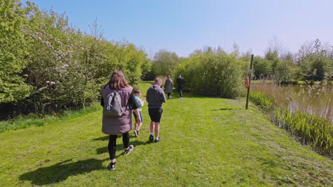 Family-enjoying-a-day-out-visiting-a-Dinosaur-theme-park-in-Lincolnshire-England