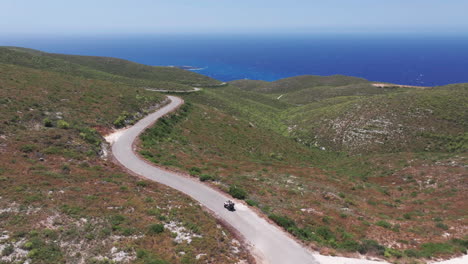 Aerial-View-of-ATV-Vehicle-on-Inland-Road-of-Zakynthos-Island,-Greece,-Tracking-Drone-Shot