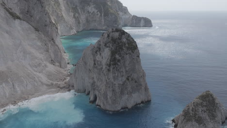 Drone-Shot-of-Cliffs,-Rocks-and-Secluded-Beach-on-Zakynthos-Island,-Greece