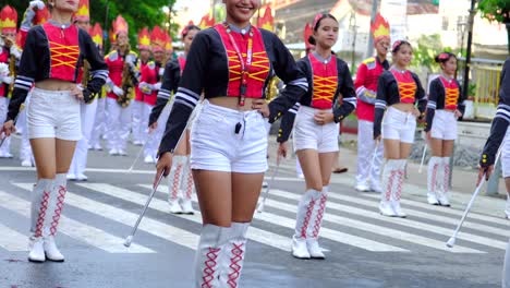 A-young-group-of-women-wearing-beautiful-costumes-on-a-street-parade