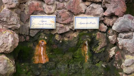 Fresh-natural-spring-water-fountains-"Água-Dr-Manuel-Henrique"-and-"Água-da-Prata"-at-the-Geysers-of-Furnas,-San-Miguel-Island,-Azores,-Portugal---July-2023