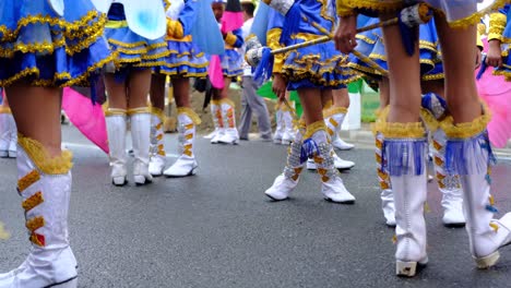 A-closeup-footage-of-children-with-unrecognizable-faces-wearing-decorated-white-knee-high-boots