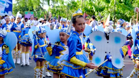 Large-crowd-of-children-wearing-blue-and-white-uniforms