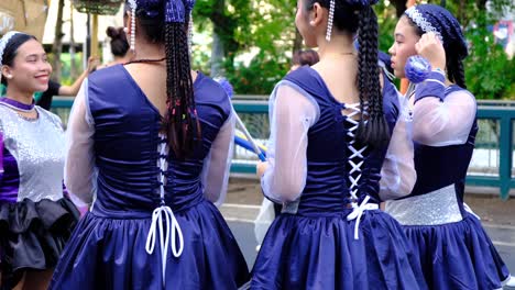 A-closeup-of-girls-parade-costumes-in-blue-color-and-pairs-of-white-boots