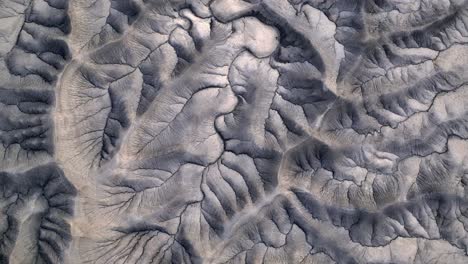 Picturesque-top-down-aerial-sideways-of-rural-Utah-grey-mountainscape,-no-life