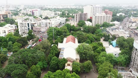 The-museum-is-located-in-the-middle-of-Rajkot-city,-aerial-view-of-the-museum-showing-lush-trees-all-around