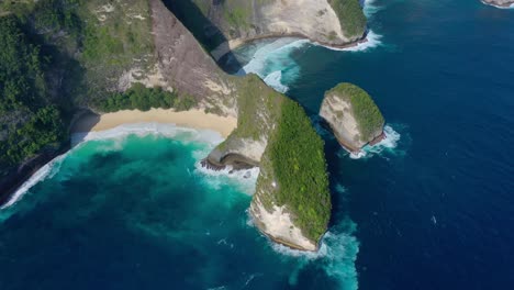 From-a-bird's-eye-view,-the-landscape-comes-alive-in-Aerial-clip,-Discover-Diamond-Beach-With-its-ivory-sands,-crystalline-waters,-iconic-rock-formations,-and-true-tropical-paradise