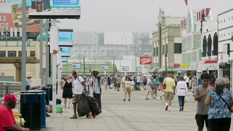 Man-Lands-Pigeon-on-His-Hand-on-Atlantic-City,-New-Jersey-Boardwalk