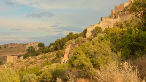 Town-And-Castle-Ruin-Over-Mountain-Landscape-In-Sagunto-Near-Valencia-In-Spain