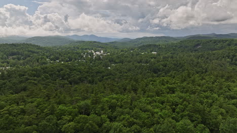 Highlands-North-Carolina-Aerial-v3-cinematic-flyover-forest-ridges-towards-Harris-lake-in-town-center-capturing-lush-forests-and-beautiful-mountainscape-in-summer---Shot-with-Mavic-3-Cine---July-2022