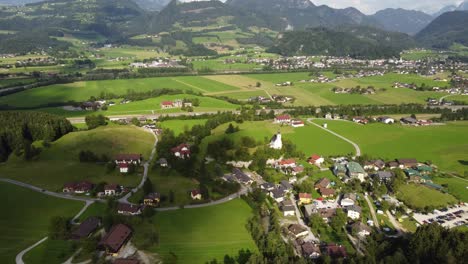 Establishing-aerial-of-small-Austrian-town-green-landscape,-Golling-an-der-Salzach
