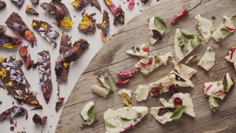 Top-view-of-pieces-of-chocolate-garnished-with-edible-flowers