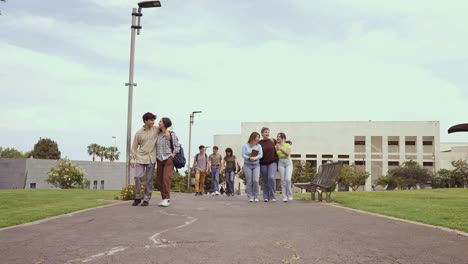 Group-of-diverse-friends-students-walking-outdoors