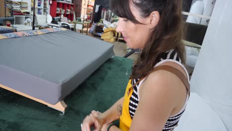 Professional-craftswoman-doing-markings-while-creating-tapestry-furniture