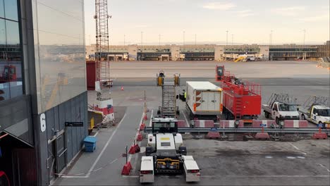 Airport-gate-and-terminal-building-with-glass-facade-at-sunset---Stockholm-international-airport-Arlanda-looking-out-airport-window