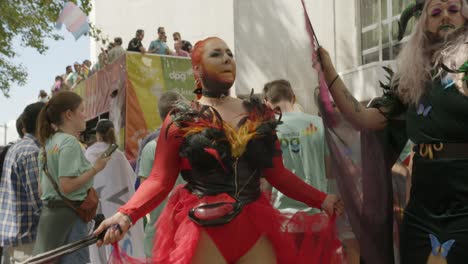 Woman-dancing-in-a-black-and-red-dress-during-the-Antwerp-Pride-Parade-2023-in-Belgium