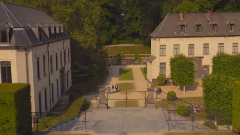 High-angle-shot-over-the-park-and-site-of-the-La-Cambre-Abbey-in-Brussels,-Belgium-on-a-sunny-day