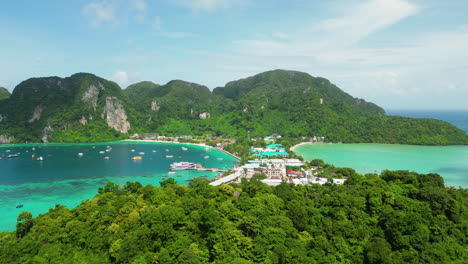 Tropical-exotic-town-in-between-two-bays-in-Phi-Phi-islands,-aerial-view