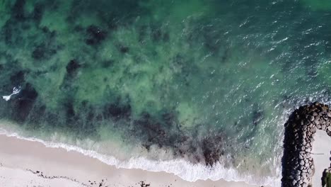 Birdseye-view-of-incoming-tide-of-Indian-Ocean-at-Burns-Beach,-Western-Australia