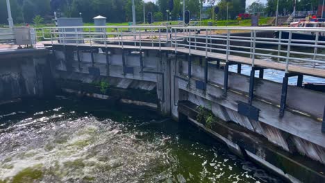 Water-flowing-through-sluice-gate-to-lower-level-in-Amsterdam-Noord
