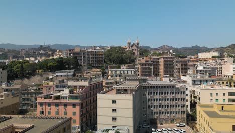 Aerial-Boom-Shot-Reveals-Messina,-Italy-Cityscape-on-Typical-Summer-Day-in-Sicily