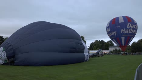 Hand-held-shot-of-multiple-hot-air-balloons-getting-ready-to-leave-Strathaven-Balloon-Festival