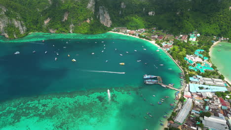 Land-bridge-with-hotel-resort,-turquoise-ocean-lagoon,-paradise-island-Thailand