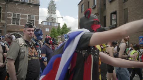 Men-in-dog-costumes-dancing-and-walking-during-the-Antwerp-Pride-Parade-2023-in-Belgium