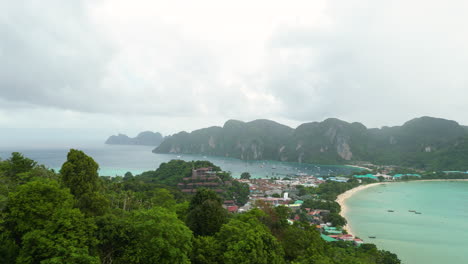 Krabi-province-thailand-koh-phi-phi-island-aerial-view-drone-revealing-scenic-beaches-in-tropical-environments-with-palm-tree-and-limestone-rock-formations-and-sandy-beaches