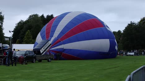 Static-shot-of-a-hot-air-balloon-filling-up-at-Strathaven-Balloon-Festival