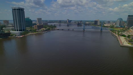 Aerial-journey-exploring-the-dynamic-cityscape-of-Jacksonville,-Florida,-on-a-sun-kissed-summer-day