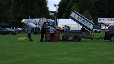 Static-shot-of-a-crew-chatting-before-setting-up-their-hot-air-ballon-at-the-Strathaven-Balloon-Festival